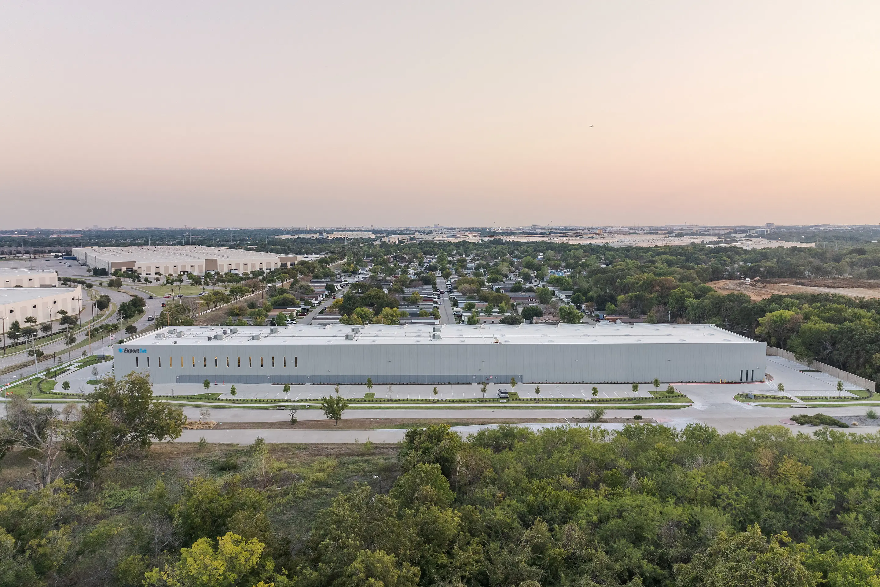Aerial view of the WesternTechSystems facility in Lewisville, Texas at dusk